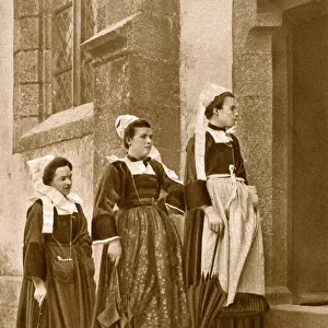 Women outside a Catholic church, Brittany, Northern France