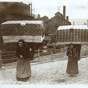 Women taking finished goods to market, Germany