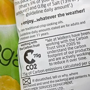 Carbon emissions label on Walkers Salt and vinegar crisp packet whose carbon footprint has been worked out in cooperation with the Carbon Trust UK