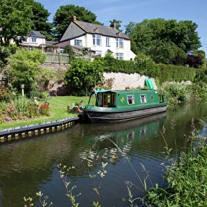 Green Canal Barge - moored on Grand Western Union Canal near Taunton Somerset UK