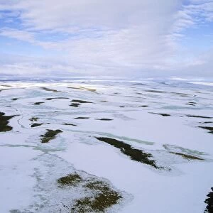 Snow melts in arctic tundra spring. Aerial view from a helicopter. A typical landscape near Kara sea, Taimyr peninsula, North of Siberia, Russian Arctic. July. Di33. 2729