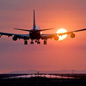Aeroplane landing at sunset, Canada