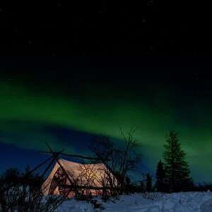 Aurora borealis over a tent