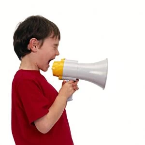 Boy shouting into a megaphone
