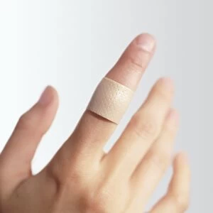 Sticking plaster on a finger