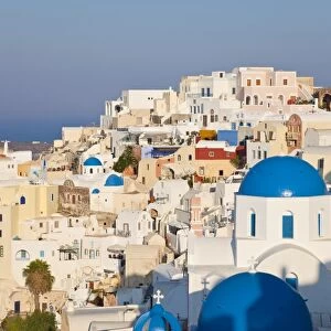 Blue domed churches in the village of Oia, Santorini (Thira), Cyclades Islands