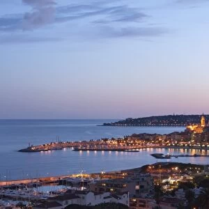 A cityscape of Menton at dusk, Provence-Alpes-Cote d Azur, French Riviera, France, Mediterranean, Europe