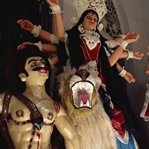 Clay based images including one of Durga, the ten armed warrior goddess