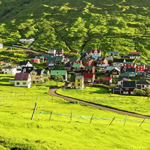 The colorful houses of the fishing village of Funningur at sunrise, Eysturoy island, Faroe islands, Denmark, Europe