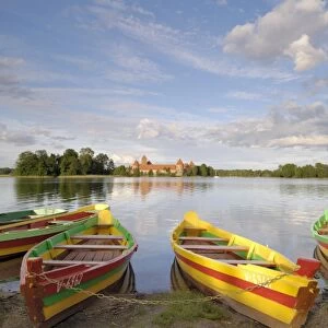 Colourful rowing boats and Trakai Castle