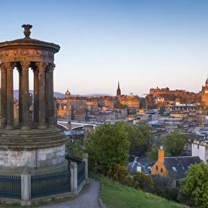 Dawn breaks over the Dugald Stewart Monument overlooking the city of Edinburgh, Lothian