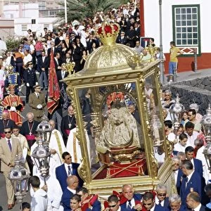 The Descent of Our Lady of Snows shrine carried through the streets during religious festival
