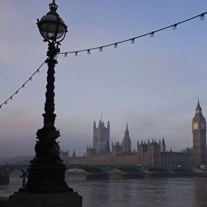 Early misty morning view of Big Ben and the Houses of Parliament across Westminster Bridge