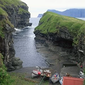 Fishing boats in a cove at Gjogv, Estoroy Island, Faroe Islands, Denmark, Europe