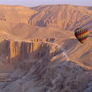 Hot air balloon floating over the Temple of Hatshepsut, Valley of the Kings