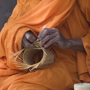 Monk making basket, Laos, Indochina, Southeast Asia, Asia