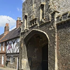 The old Abbey entrance and medieval timber framed houses, High Street, Little Walsingham, Norfolk, England, United Kingdom, Europe