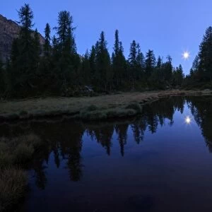 Panorama of the blue Lake Mufule lit by the moon, Malenco Valley, Province of Sondrio