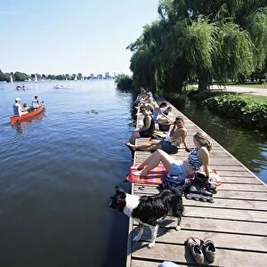 People at the Aussenalster lake in the middle of the city