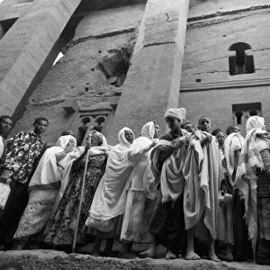 Pilgrims in front of Beth Medhane Alem monolithic church, Lalibela, Ethiopia, Africa