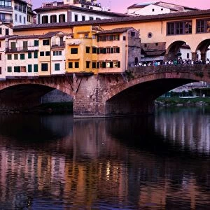 Ponte Vecchio at sunset reflected in the River Arno, Florence, UNESCO World Heritage Site