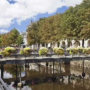 The River Odet and a flower decorated bridge, Quimper, Finistere, Brittany, France, Europe