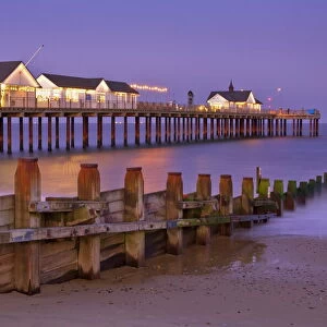 Southwold pier and wooden groyne at sunset, Southwold, Suffolk, England