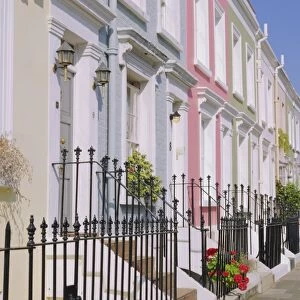 Terraced houses and wrought iron railings, Kensington, London, England, UK