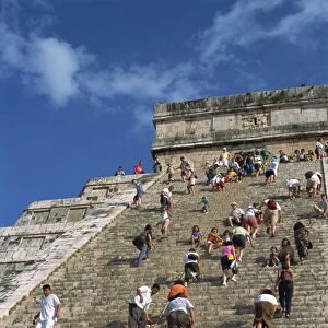 Tourists climbing El Castillo