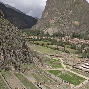 Tourists visit the ruins of the Inca archaeological site of Ollantaytambo near Cusco