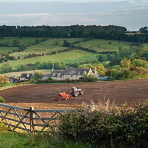 Tractor ploughing fields in Blockley, The Cotswolds, Gloucestershire, England, United Kingdom, Europe