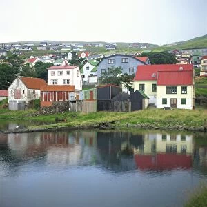 Traditional waterfront houses in the town of Westmannhavn, Stremoy Island