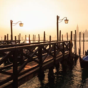 Venetian sunrise, winter fog, gondolas, San Giorgio Maggiore and Lido, Venice