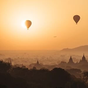 View of temples and hot air balloons at dawn, Bagan (Pagan), Mandalay Region, Myanmar (Burma)