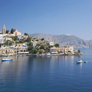 View across the tranquil waters of Harani Bay, Gialos (Yialos), Symi (Simi), Rhodes