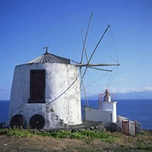 Windmill on Corvo with the island of Flores in the background