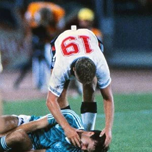 Paul Gascoigne check on Thomas Berthold before being booked in the semi-final of the 1990 World Cup