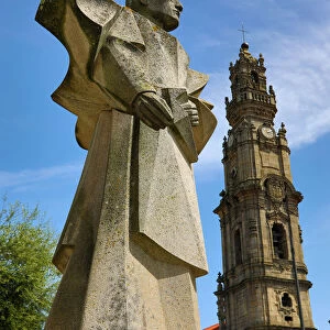 Statue of Antonio Ferreira Gomes and the Clerigos Tower in Porto, Portugal