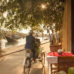 Cyclos passing restaurant, Hoi An (UNESCO World Heritage Site), Quang Ham, Vietnam