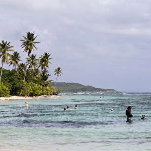 France, Guadeloupe, Sainte-Anne, People bathing at Bois Jolan beach