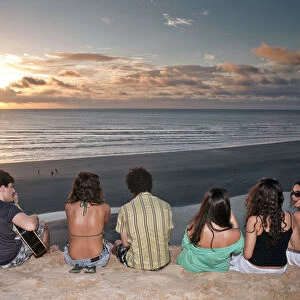 South America, Brazil, Ceara, Jericoacoara, a guitarist and a group of girls watch