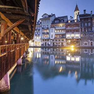 Traditional houses are reflected in the Aare river. Thun, Canton of Bern, Switzerland