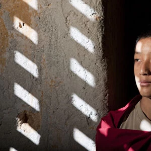 A young monk at the blue palace in Bhutan