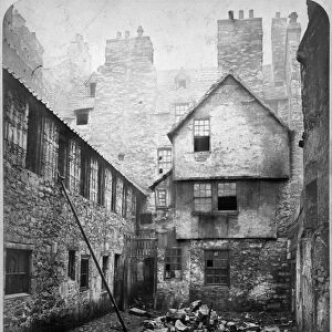 View of houses on East side of College Wynd, Edinburgh, prior to demolition. Date: 1871