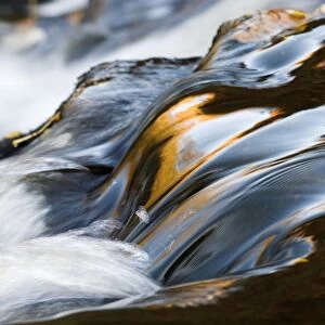 Abstract of cascade in mountain stream, Cumbria, England