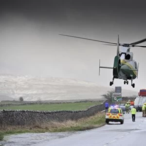 Air Ambulance attending road traffic accident in icy weather, Kirkby Stephen, Cumbria, England, December