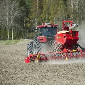 Case 225 CVX tractor with Vaderstad Rapid A 600S seed drill, drilling arable field, Upplands Vasby, Sweden, may