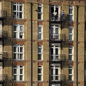 City apartment building facade with balconies, London, England, april