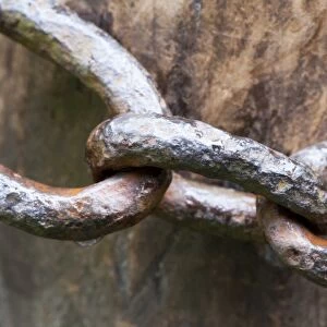 Close-up of old metal chain around gatepost, North Yorkshire, England, July