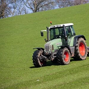 Fendt Favorit 716 tractor with rollers, rolling grassland pasture, England, april
